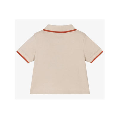 Short sleeve boys polo shirt in beige with contrasting orange collar and sleeve trim.
