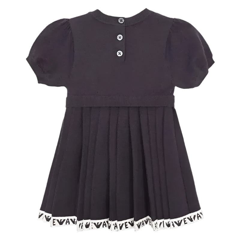 Navy short sleeve pleated dress for girls with a round neckline and button closures at the back, featuring a logo trim at the hem.