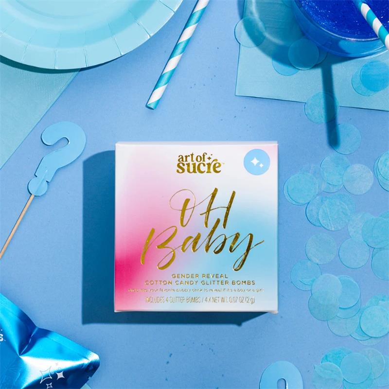 Art Of Sucre blue gender reveal cotton candy drink glitter bombs packaging with glittery text and colorful decor elements.