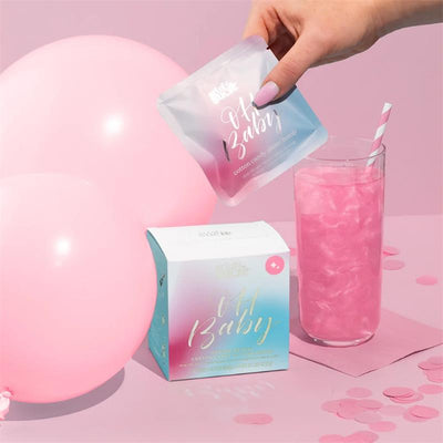 Art of Sucre Gender Reveal Pink Cotton Candy Drink Glitter Bombs with a pink beverage and balloons