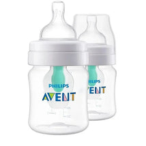 Two clear 4oz Avent anti-colic baby bottles with Airfree vent, featuring a white cap and a green silicone nipple.