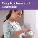 A woman assembles a clear 11oz Avent baby bottle with a natural response nipple, emphasizing easy cleaning.