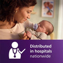 Mother holding a baby with a pacifier, featuring text about hospital distribution. The pacifier is in fresh lilac and pastel pink colors.