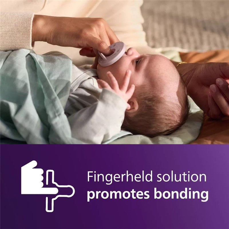 Avent 2Pk Soothie Pacifier in fresh lilac and pastel pink held by a caregiver, promoting bonding with the baby.