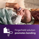 Avent 2Pk Soothie Pacifier in fresh lilac and pastel pink held by a caregiver, promoting bonding with the baby.