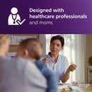 Healthcare professional discussing pacifiers with a child and parent, emphasizing design and comfort for infants.