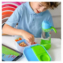 A child in a blue shirt uses a B.box Mini Lunchbox in Ocean Breeze colors, filled with healthy snacks, next to a water bottle.