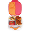 B.box Mini Lunchbox in Strawberry Shake color, featuring compartments with an apple, yogurt with granola, and two slices of savory food.