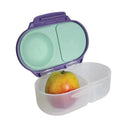 B.box Snackbox in Lilac Pop color, open to reveal an apple in one compartment and a separate section for snacks.