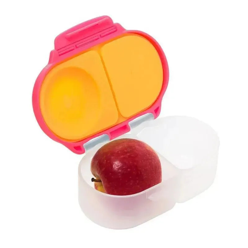 B.box Snackbox in pink, featuring two compartments; one holds a red apple, the other is empty.