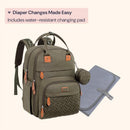 Army green diaper bag backpack with changing pad, featuring zippered pockets and leather accents for travel essentials.