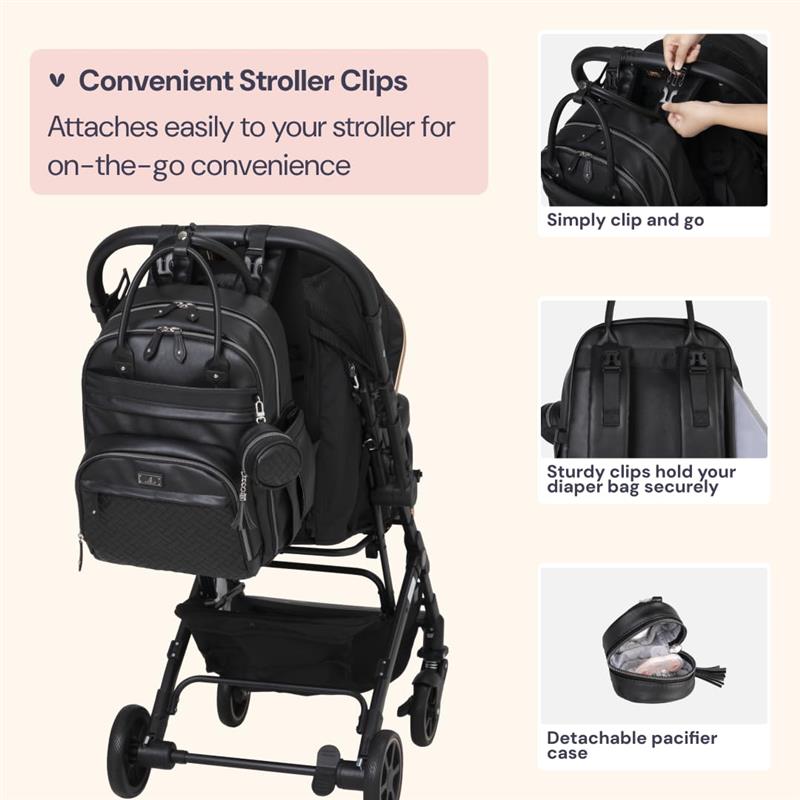 Black leather diaper bag backpack attached to a stroller, showcasing clips and a detachable pacifier case.