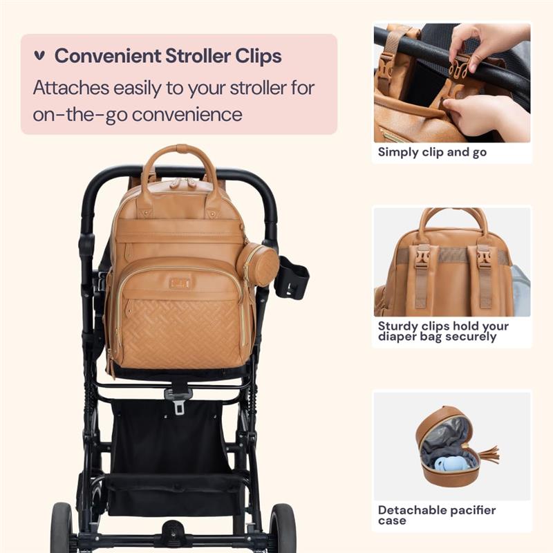 Light brown vegan leather diaper bag attached to a stroller, featuring clips for easy attachment and a detachable pacifier case.