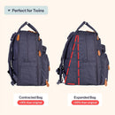 Denim blue baby bag tote, shown in contracted and expanded states, highlighting its adjustable capacity.