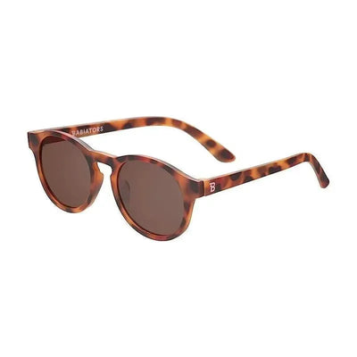Children’s keyhole-shaped Babiators sunglasses in a tortoise pattern with amber polarized lenses, suitable for ages 3-5.
