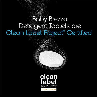 Baby Brezza detergent tablets with Clean Label Project certification, featuring a white tablet and bubble effects on a dark background.