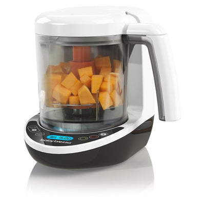 Baby Brezza Food Maker Complete with visible chopped vegetables inside, featuring a digital control panel on the base.