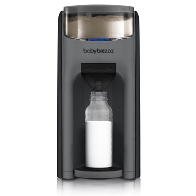 Baby Brezza Formula Pro Advanced dispenser in charcoal, dispensing formula into a clear baby bottle.