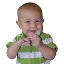 Smiling baby in a green and white striped shirt holding a small toothbrush for oral care.