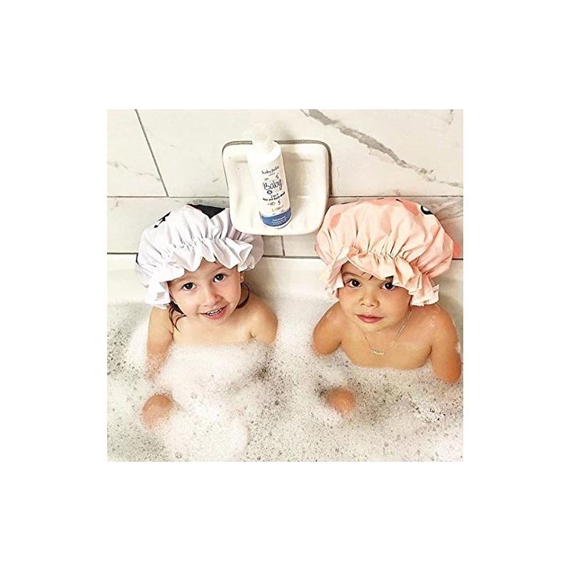 Two children sitting in a bubble bath wearing colorful shower caps, with a Baby Jolie shampoo bottle in the background.