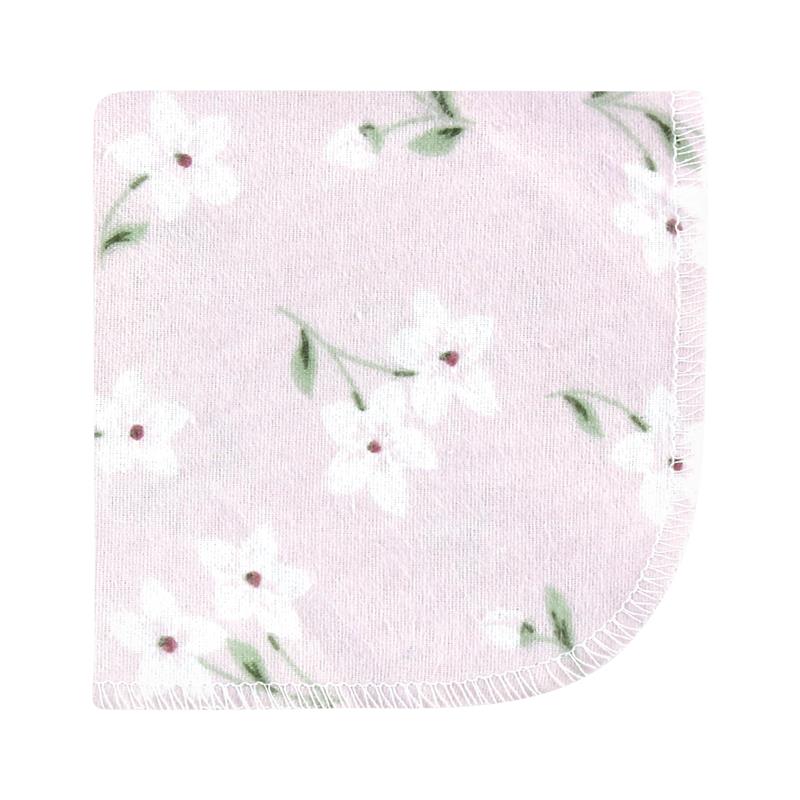 Flannel washcloth in purple with a dainty floral pattern featuring white flowers and green leaves.