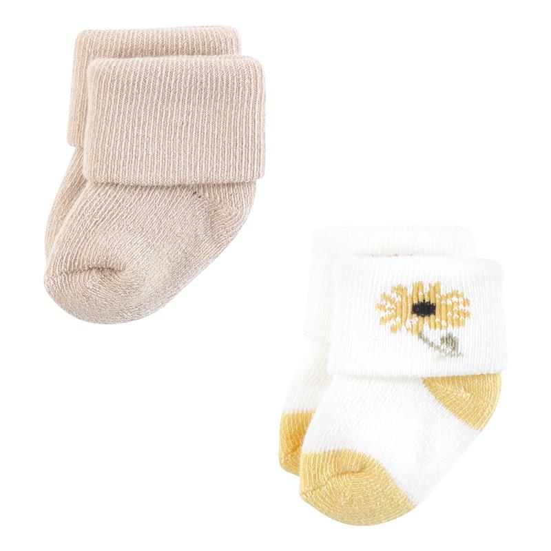 Soft organic terry socks for babies, featuring one pair in beige and another with a sunflower design in white and yellow.
