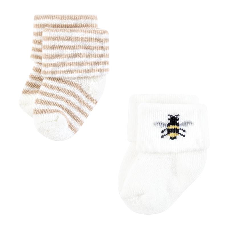 Organic terry socks for babies featuring soft wildflower designs, with one pair in beige stripes and another with a bee motif.
