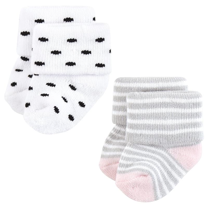 Set of four baby socks featuring two pairs: one with black dots on white and another striped in gray and pink.
