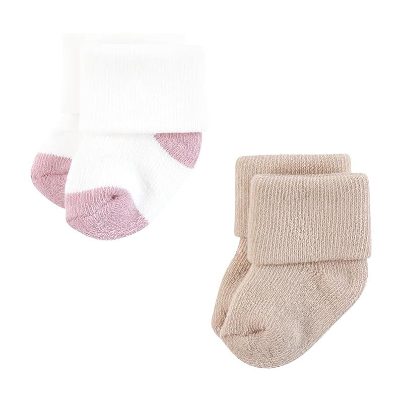 Soft terry socks for girls in pastel colors, featuring a white and pink pair alongside a beige pair.