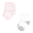 Soft baby socks in pink and white colors with fold-over cuffs and contrasting soles, ideal for infants.