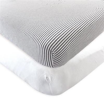 Organic cotton crib sheets in white and charcoal stripes, designed for baby cribs.