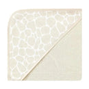 Cotton-rich hooded towel featuring a cream color with a gentle giraffe skin print, ideal for infants.