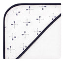 Hooded towel with a white body featuring navy arrows and a soft, absorbent orange underside.