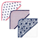 Hooded towels for babies featuring organic cotton in three designs: daisies, stripes, and floral patterns.