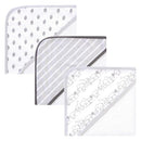 Three organic cotton hooded towels for babies, featuring safari-themed designs: leaves, stripes, and animal illustrations.