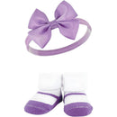 Baby Vision 6Pk Headband and Sock Set featuring a purple bow headband and white socks with purple stripes.