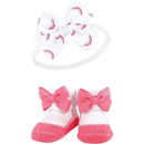 Rainbow-themed headband and matching socks set for babies, featuring pink bows and a white base with rainbow patterns.