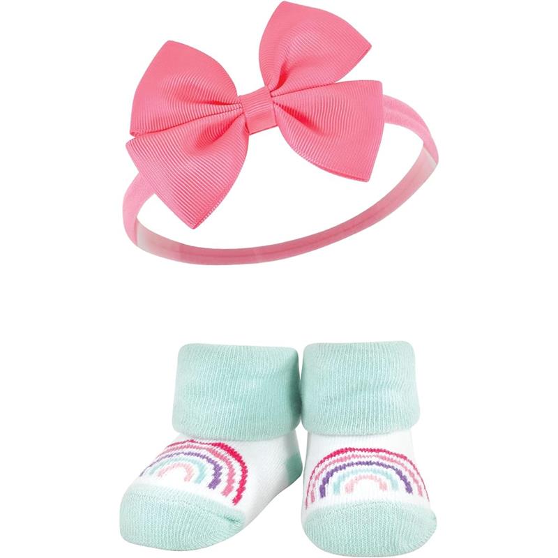 Rainbow-themed baby headband with a pink bow and matching socks featuring pastel rainbow patterns.