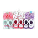 Six-piece headband and sock set for babies, featuring colorful socks with rainbow designs and matching bows. Suitable for 0-9 months.
