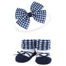 Navy gingham headband with a large bow and matching cozy socks with a fold-over cuff and bow details.
