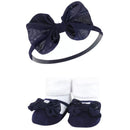 Navy gingham baby headband with a large bow and matching socks, featuring a white top and navy base with bows.