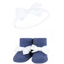 Navy gingham headband with a white bow above matching navy socks with white bows at the front, part of a 6-pack set.