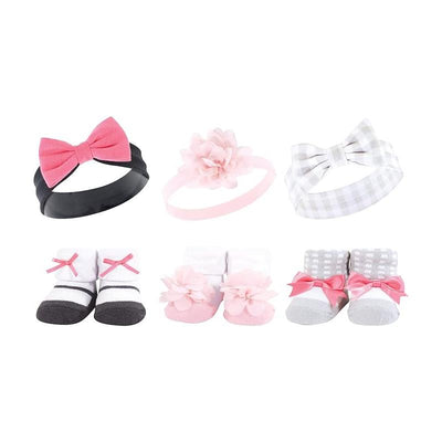 Six-piece baby accessory set featuring headbands with bows and floral designs, paired with cozy socks in pink and charcoal.