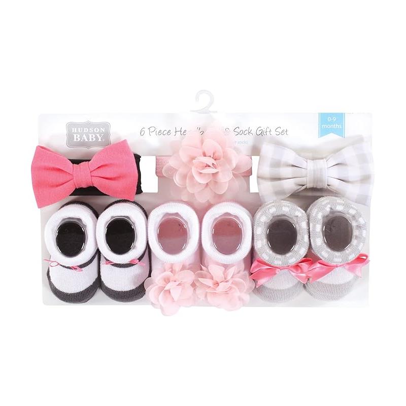 Six-piece baby headband and sock gift set featuring pink and charcoal colors, including bows and flower decorations.