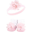 Pink headband with a flower and matching pink and white socks with floral embellishments. Suitable for babies.