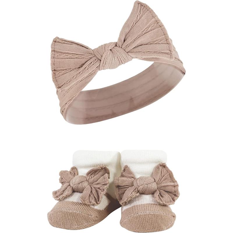 Knit headband and sock set in pink taupe featuring a textured bow on the headband and matching bow-topped socks.