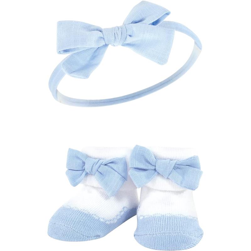 Linen headband with a blue bow and matching blue and white socks with bows, part of a baby accessories set.