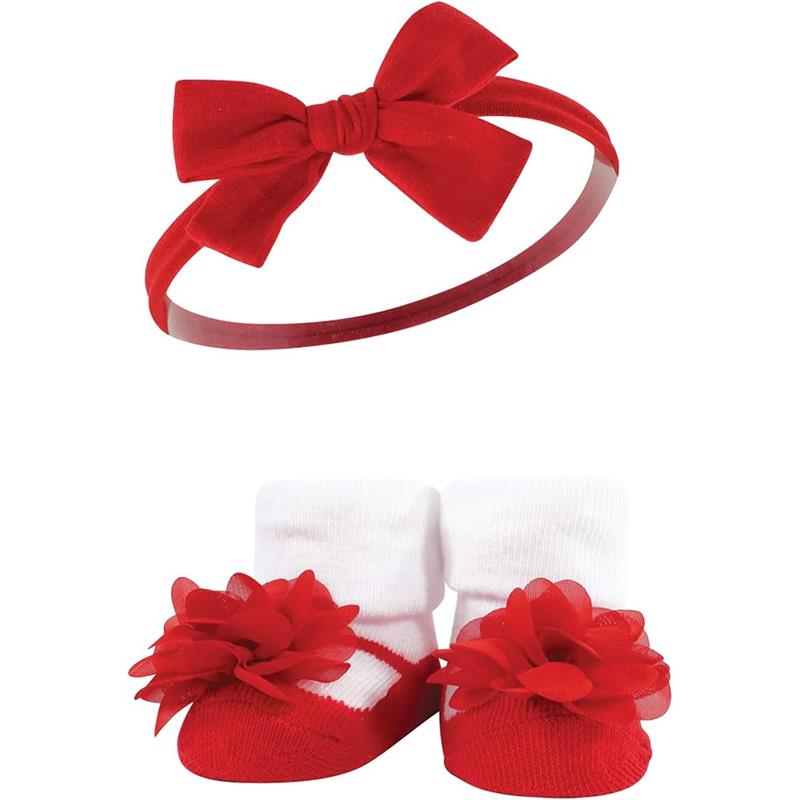 Red and blue Baby Vision headband with a bow, paired with white socks featuring red flower embellishments.