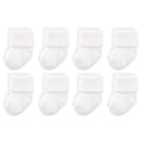 Eight pairs of white terry socks for newborns, featuring a rolled cuff design.