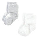 Soft, fluffy socks in gray and white, designed for infants aged 12 to 24 months. Ideal for warmth and comfort.